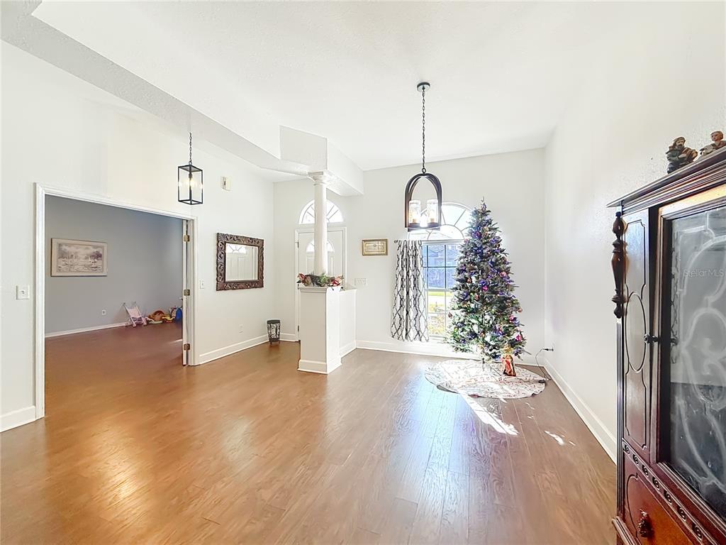 2301 Southeast 22nd Loop Ocala, FL 34471 - Photo 9 of 55 a living room with furniture and a chandelier