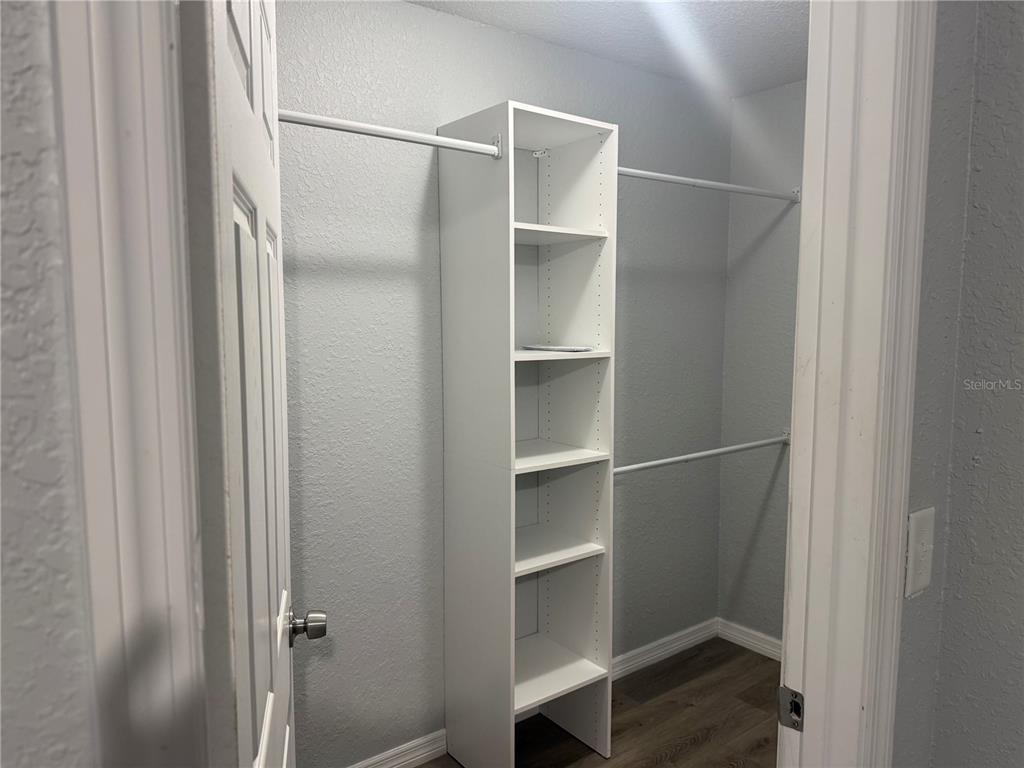 12847 Southwest 84th Terrace Road Ocala, FL 34473 - Photo 8 of 16 a view of walk in closet with empty racks