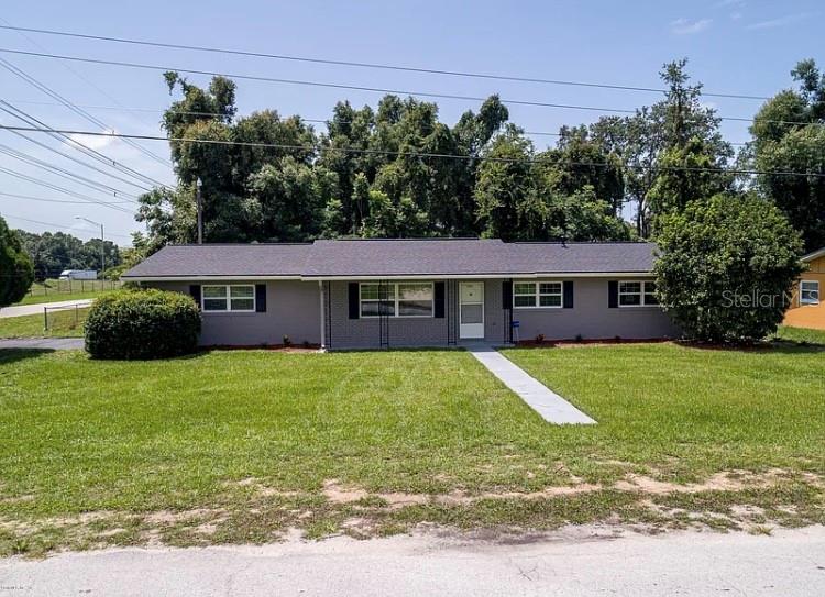 3800 Southwest 22nd Street Ocala, FL 34474 - Photo 3 of 23 a front view of a house with a garden