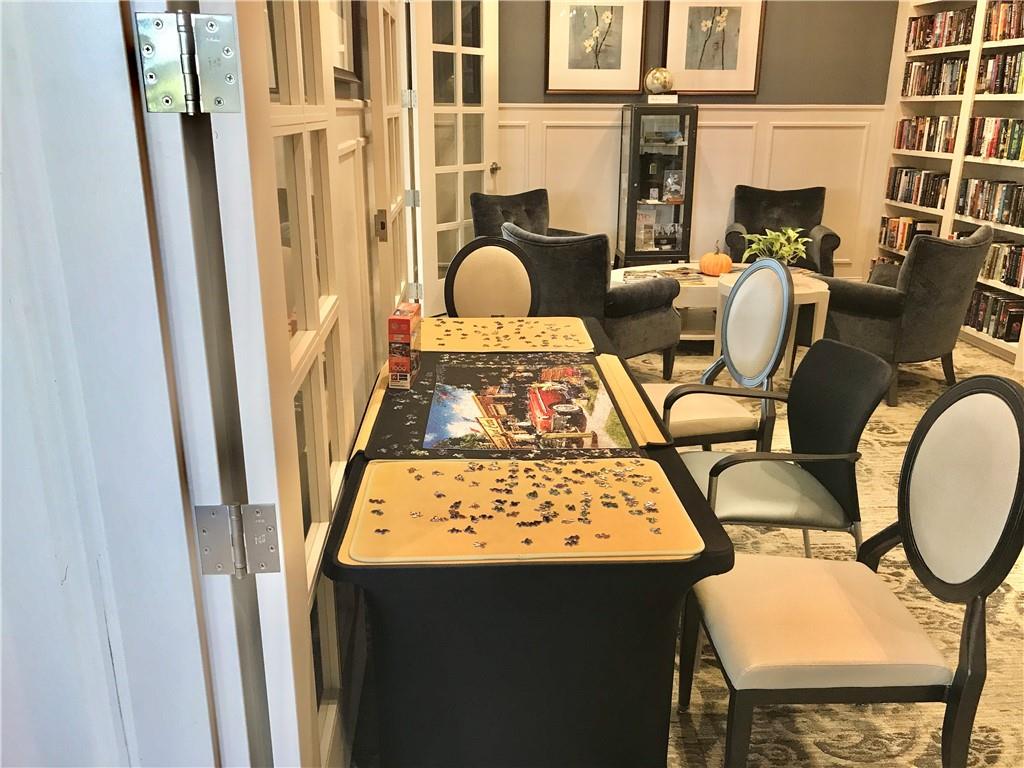 5222 Morrell Road Hoschton, GA 30548 - Photo 30 of 45 a view of balcony with furniture and wooden floor