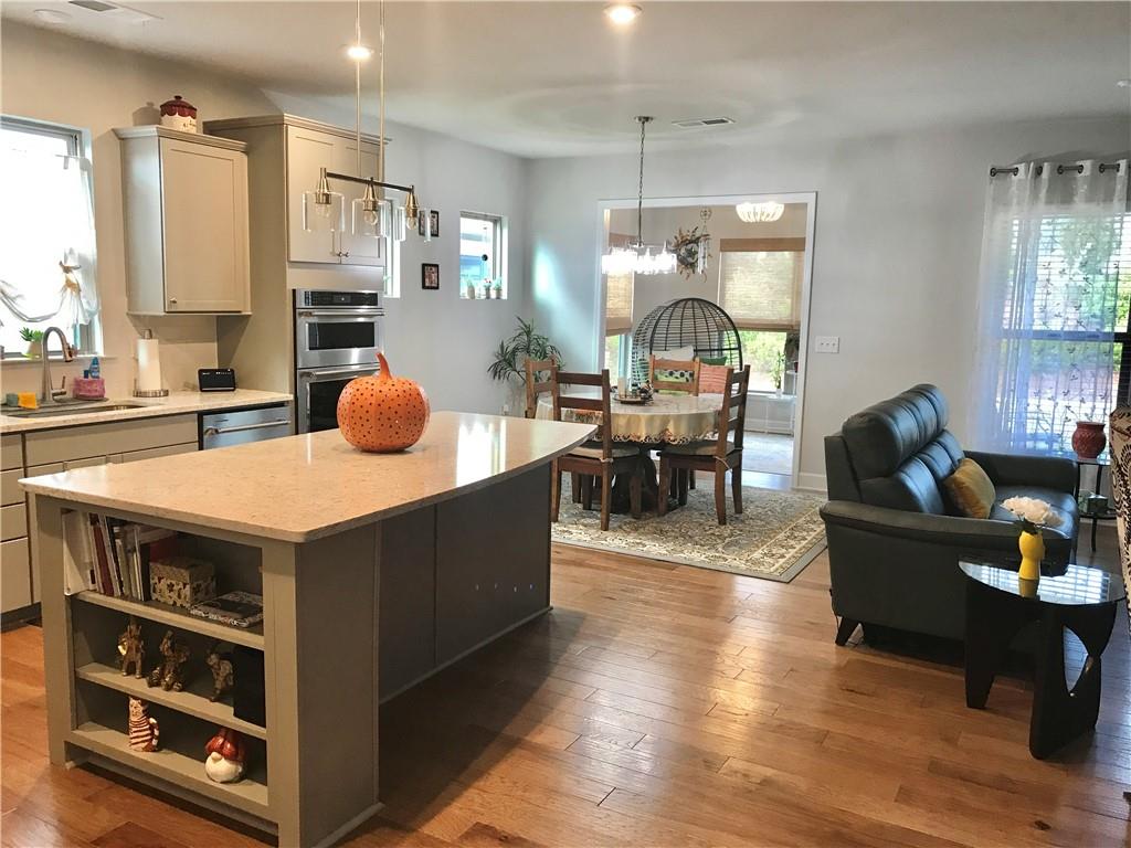 5222 Morrell Road Hoschton, GA 30548 - Photo 3 of 45 a living room with furniture and a wooden floor