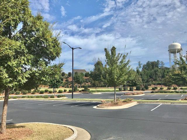 5222 Morrell Road Hoschton, GA 30548 - Photo 36 of 45 a view of a tennis ground with large trees