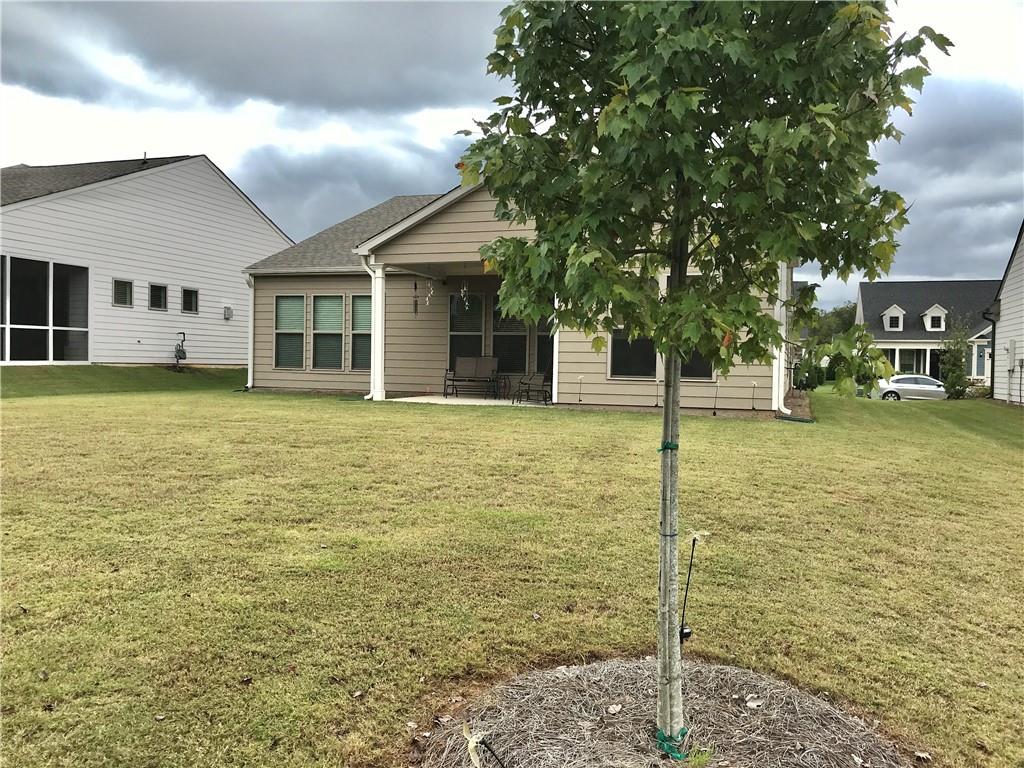 5222 Morrell Road Hoschton, GA 30548 - Photo 43 of 45 a swimming pool with trees in front of it