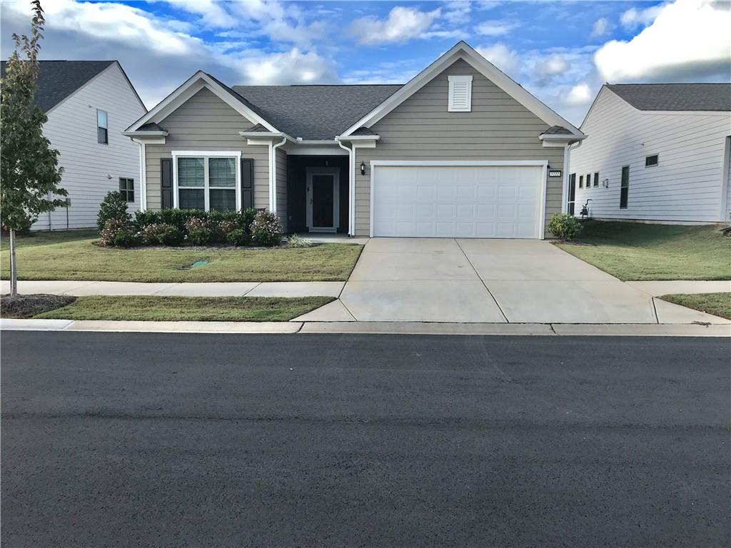 5222 Morrell Road Hoschton, GA 30548 - Photo 45 of 45 a front view of a house with a yard and garage