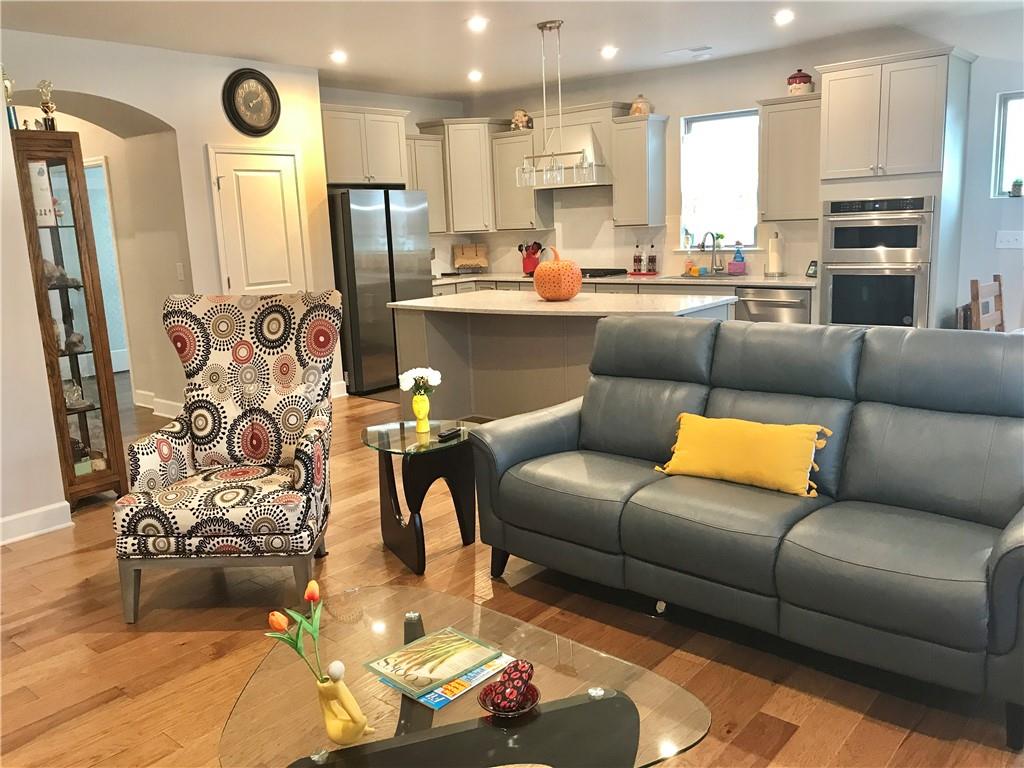 5222 Morrell Road Hoschton, GA 30548 - Photo 8 of 45 a living room with stainless steel appliances furniture and a large window