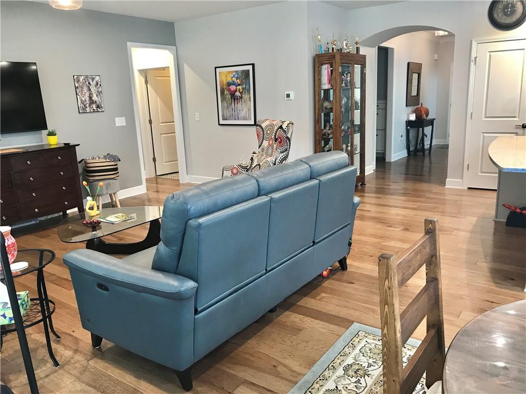 5222 Morrell Road Hoschton, GA 30548 - Photo 10 of 45 a living room with furniture and a flat screen tv