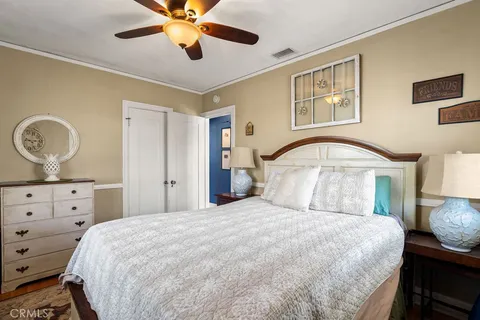 a bedroom with furniture and a window