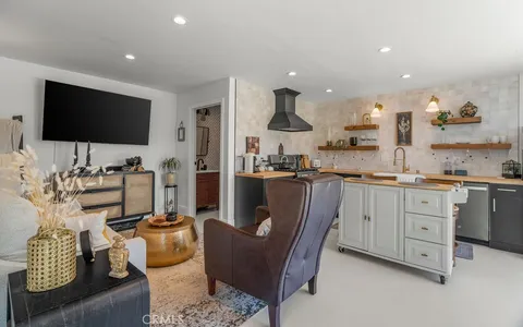 a kitchen with cabinets and stainless steel appliances