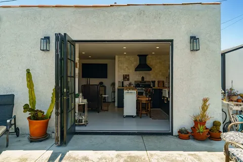 a view of a backyard with sitting area