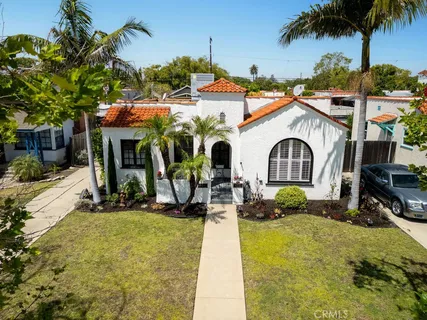 an aerial view of a house with a swimming pool