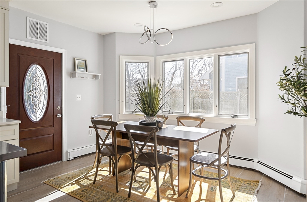 51 Reed Street, Unit 51 Cambridge, MA 02140 - Photo 9 of 27 a view of a dining room with furniture window and outside view