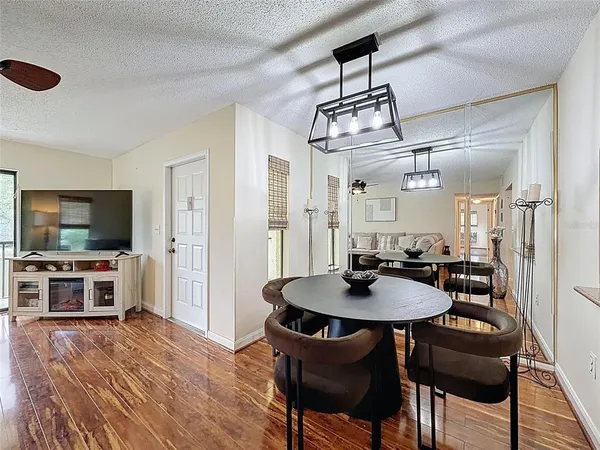 a kitchen with granite countertop cabinets stainless steel appliances and a counter space