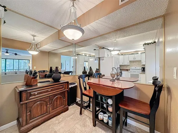 a kitchen with cabinets appliances a sink and a counter top space