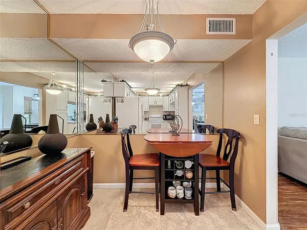 a kitchen with cabinets and window