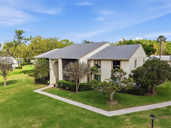 a aerial view of a house with garden and plants