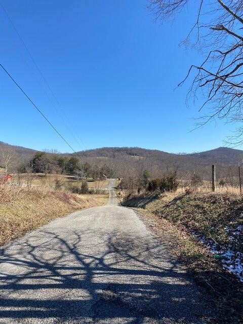 4 Reeder Town Road Byrdstown, TN 38549 - Photo 2 of 6 a view of a yard next to a building