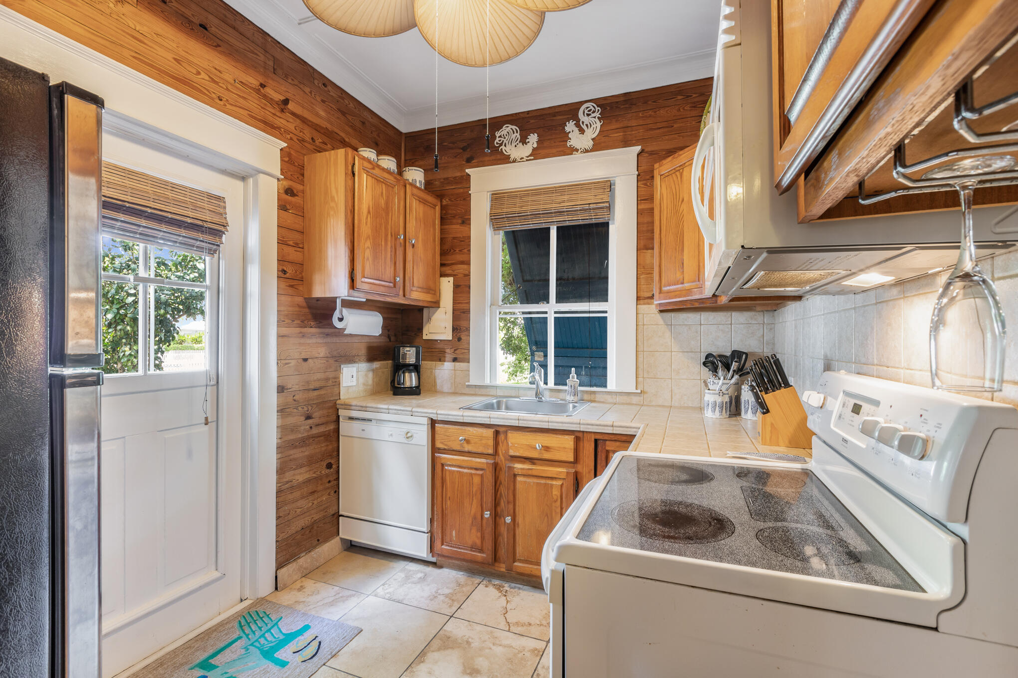 1203 Newton Street, Unit 1 Key West, FL 33040 - Photo 13 of 25 a kitchen with a stove and a sink