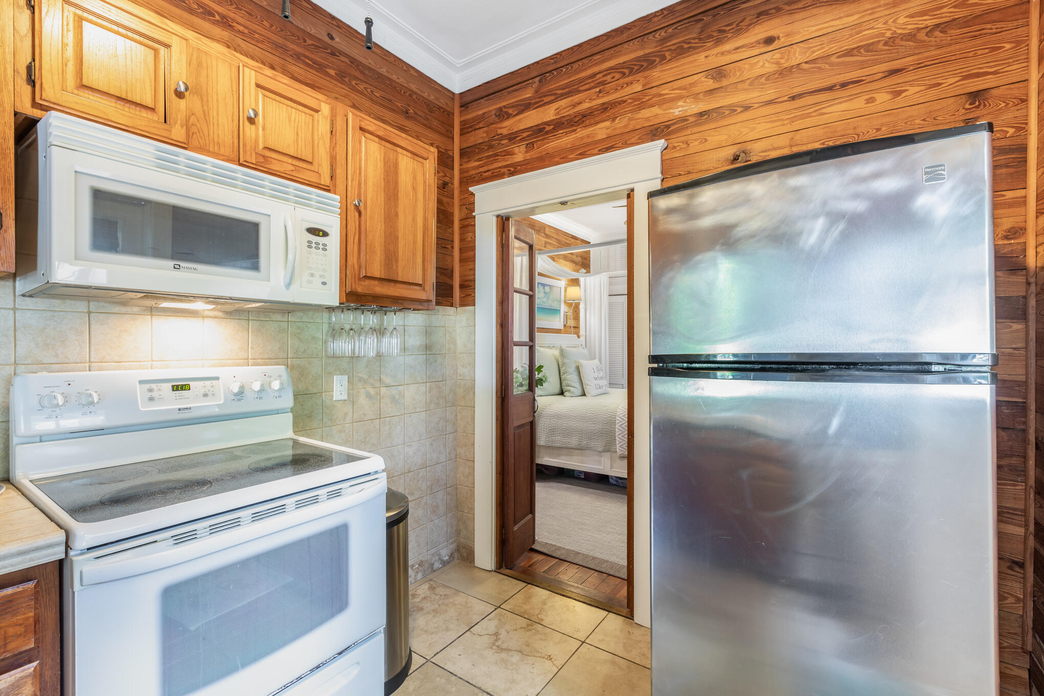 1203 Newton Street, Unit 1 Key West, FL 33040 - Photo 15 of 25 a kitchen with a stove and a microwave