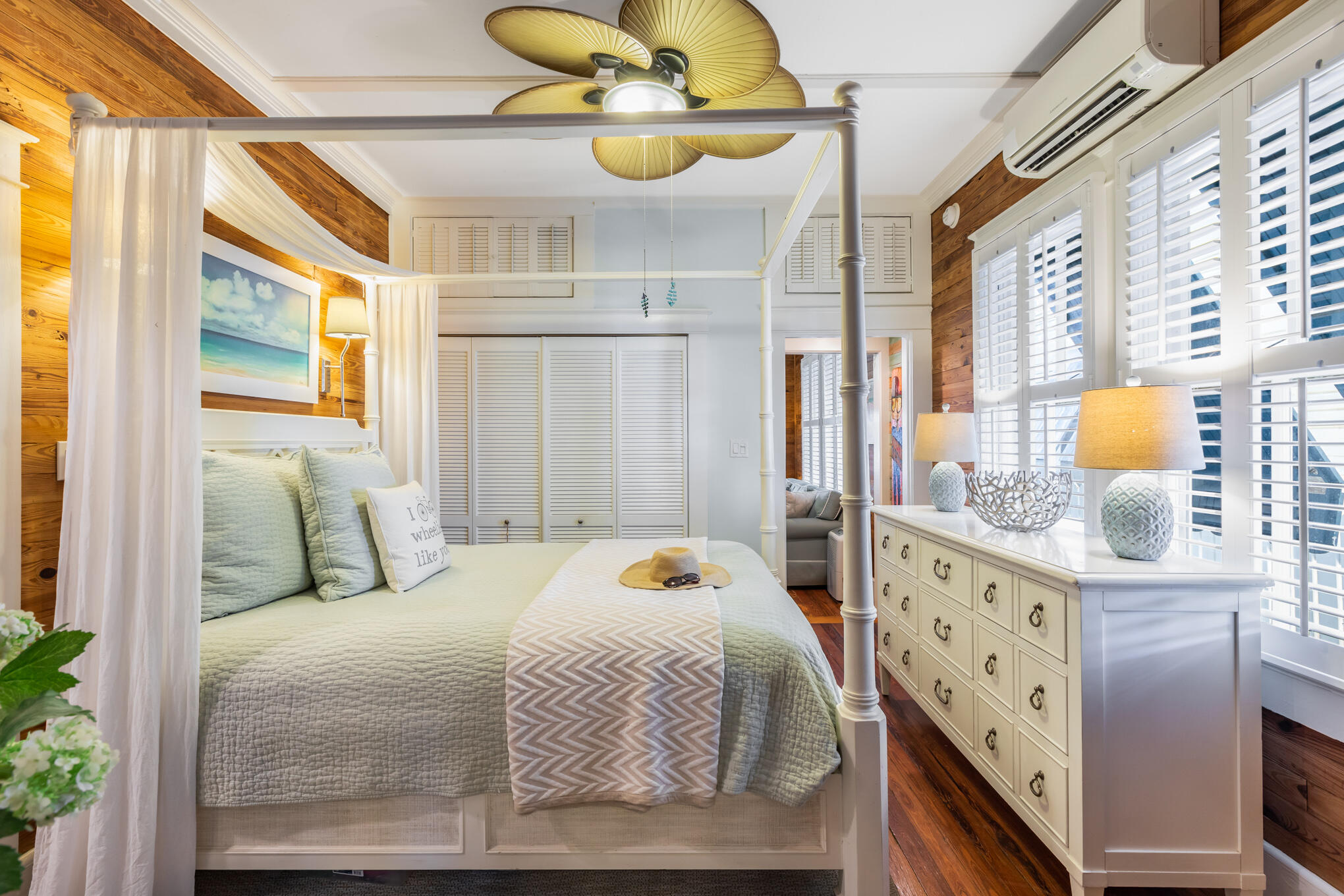 1203 Newton Street, Unit 1 Key West, FL 33040 - Photo 19 of 25 a bedroom with a bed and wooden floor