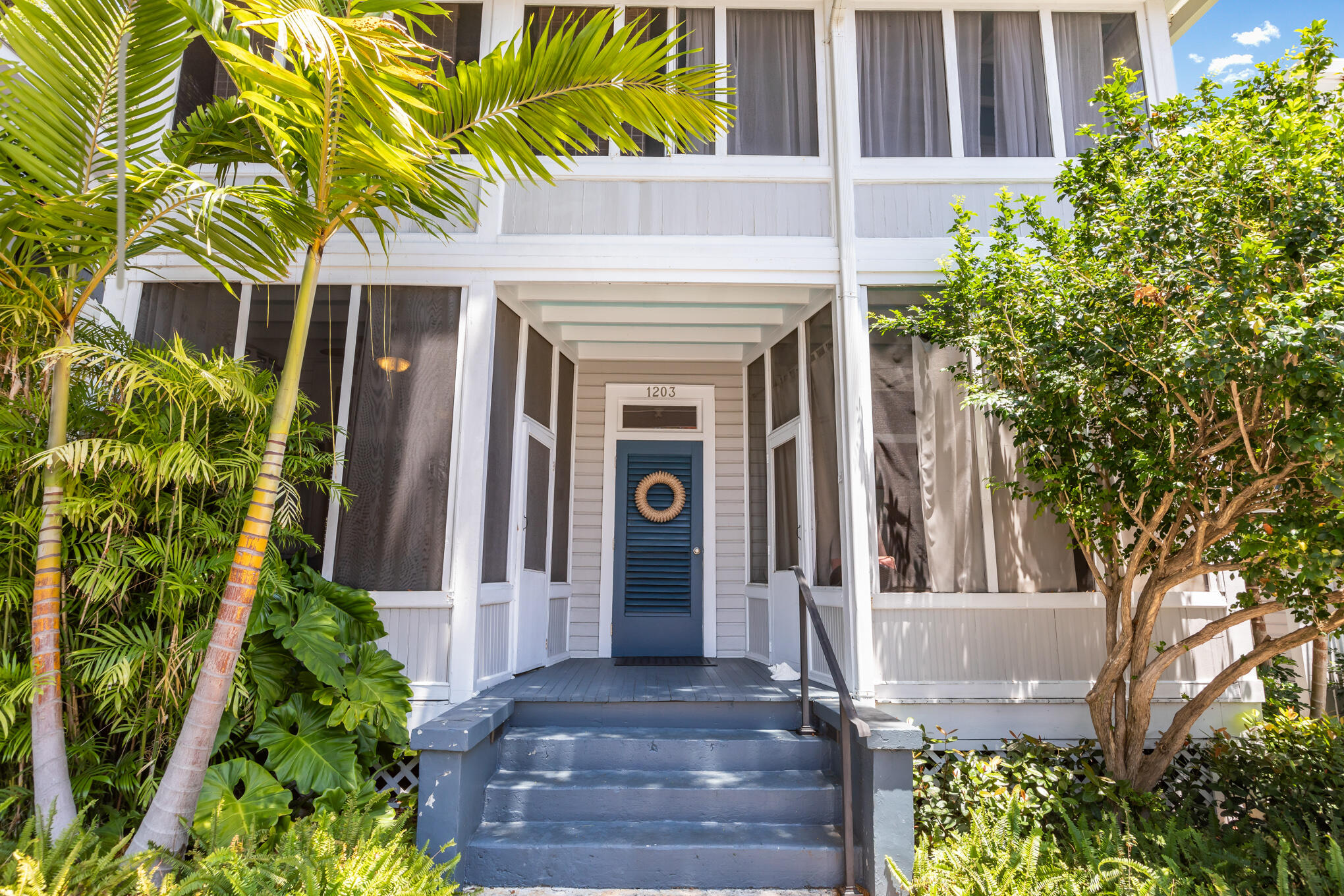 1203 Newton Street, Unit 1 Key West, FL 33040 - Photo 3 of 25 a front view of a house with garden