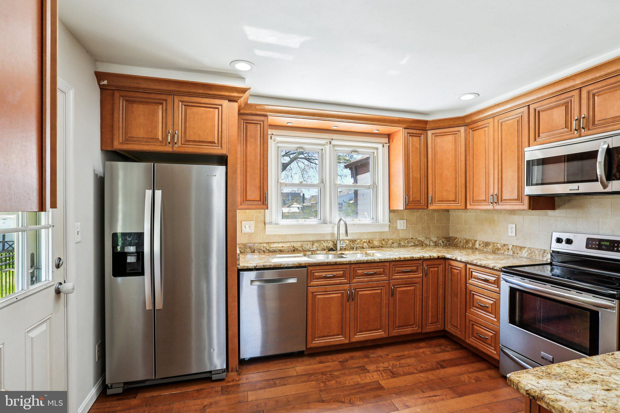 2203 Middleborough Road Essex, MD 21221 - Photo 18 of 35 Modern kitchen with warm wood tones.