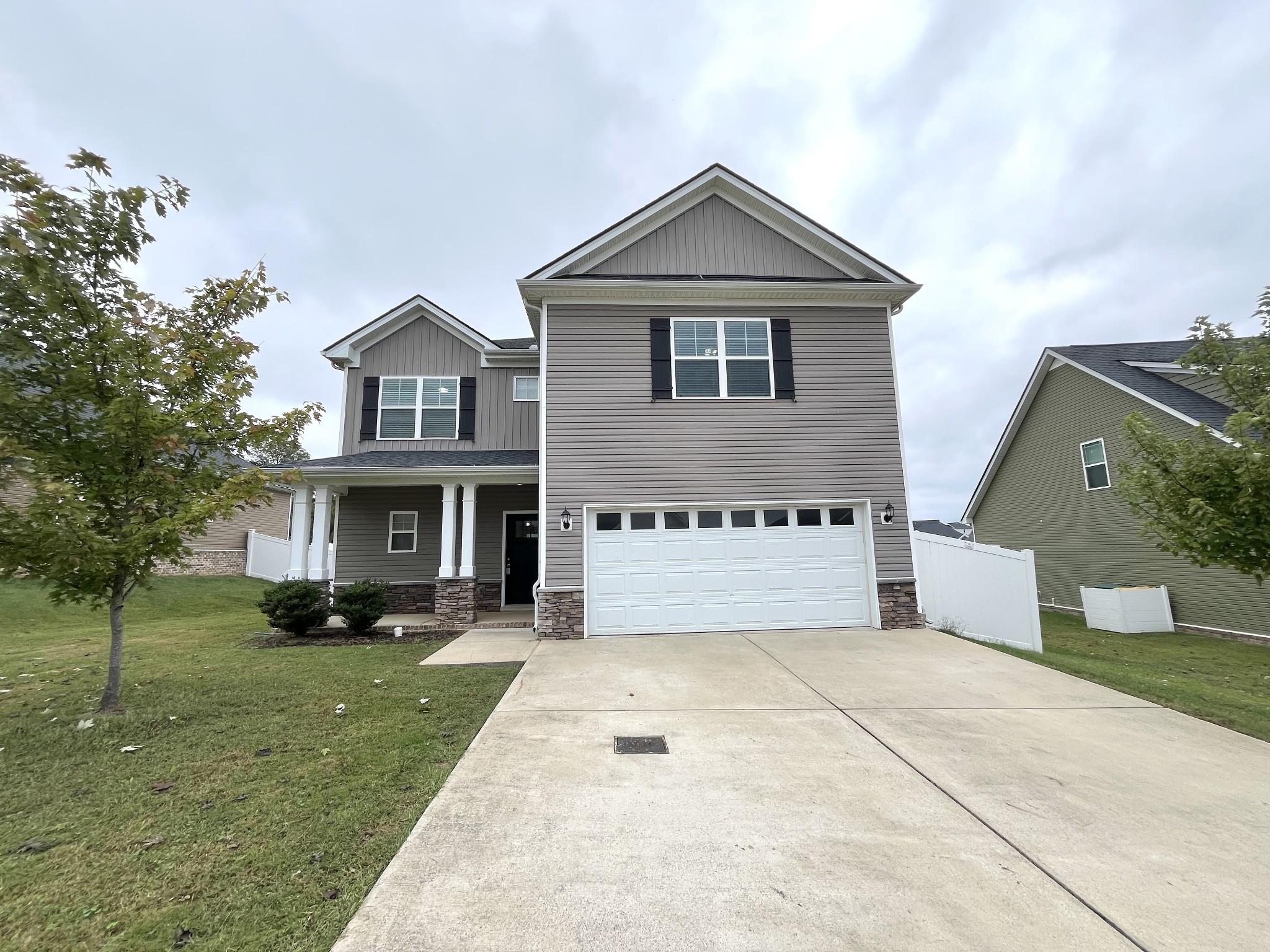 a front view of a house with a yard