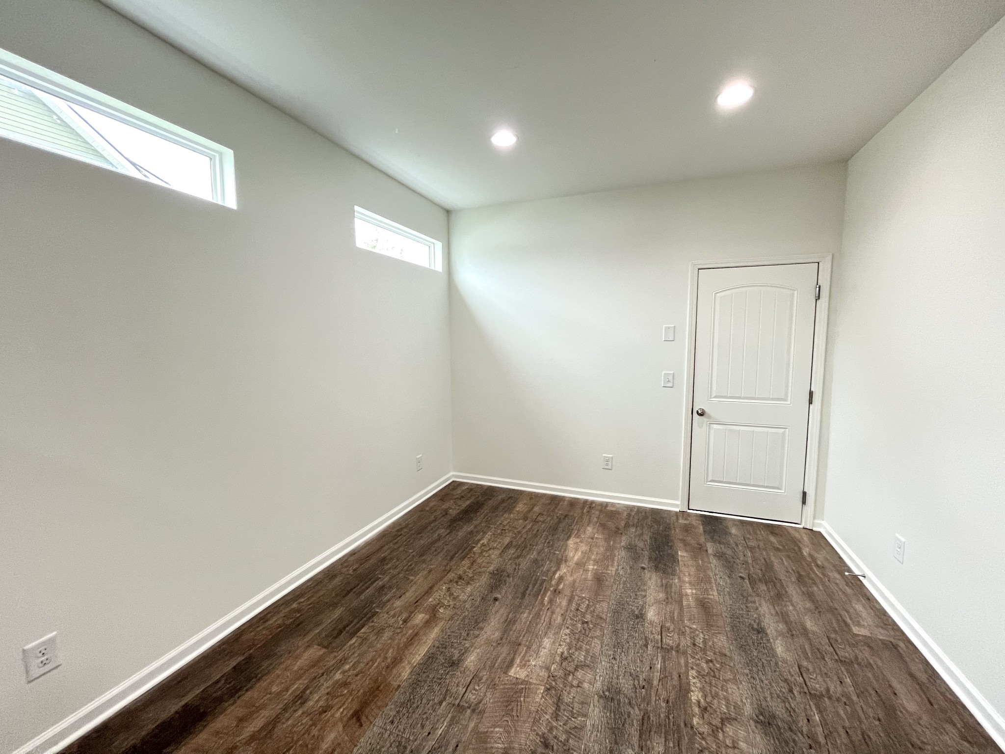 105 East Coker Way Spring Hill, TN 37174 - Photo 13 of 23 an empty room with wooden floor and windows