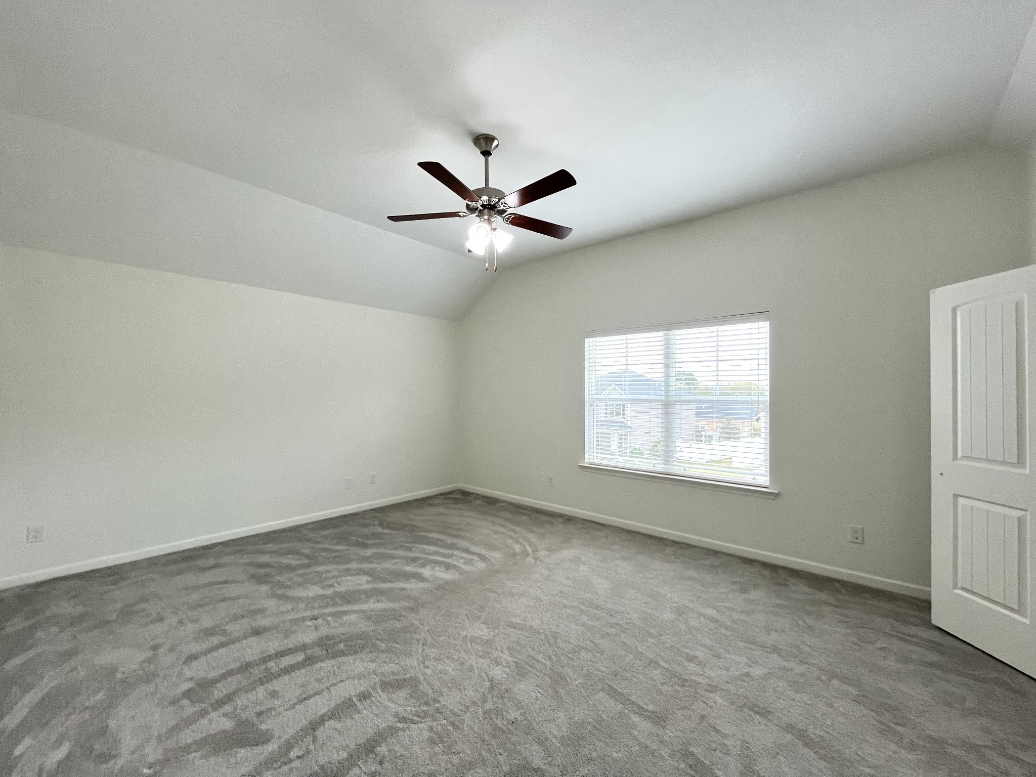 105 East Coker Way Spring Hill, TN 37174 - Photo 15 of 23 an empty room with windows and ceiling fan