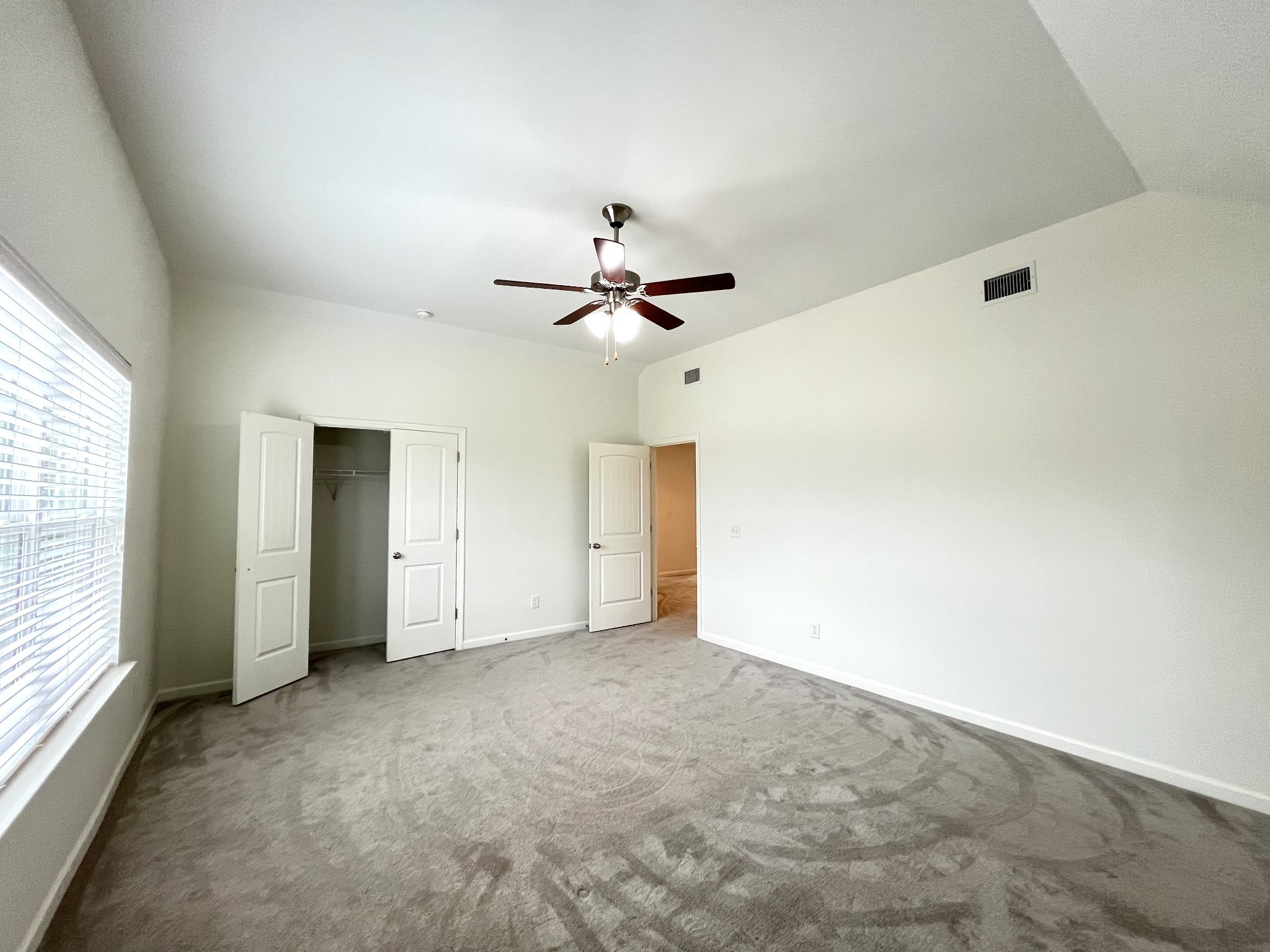 105 East Coker Way Spring Hill, TN 37174 - Photo 16 of 23 an empty room with closet and windows