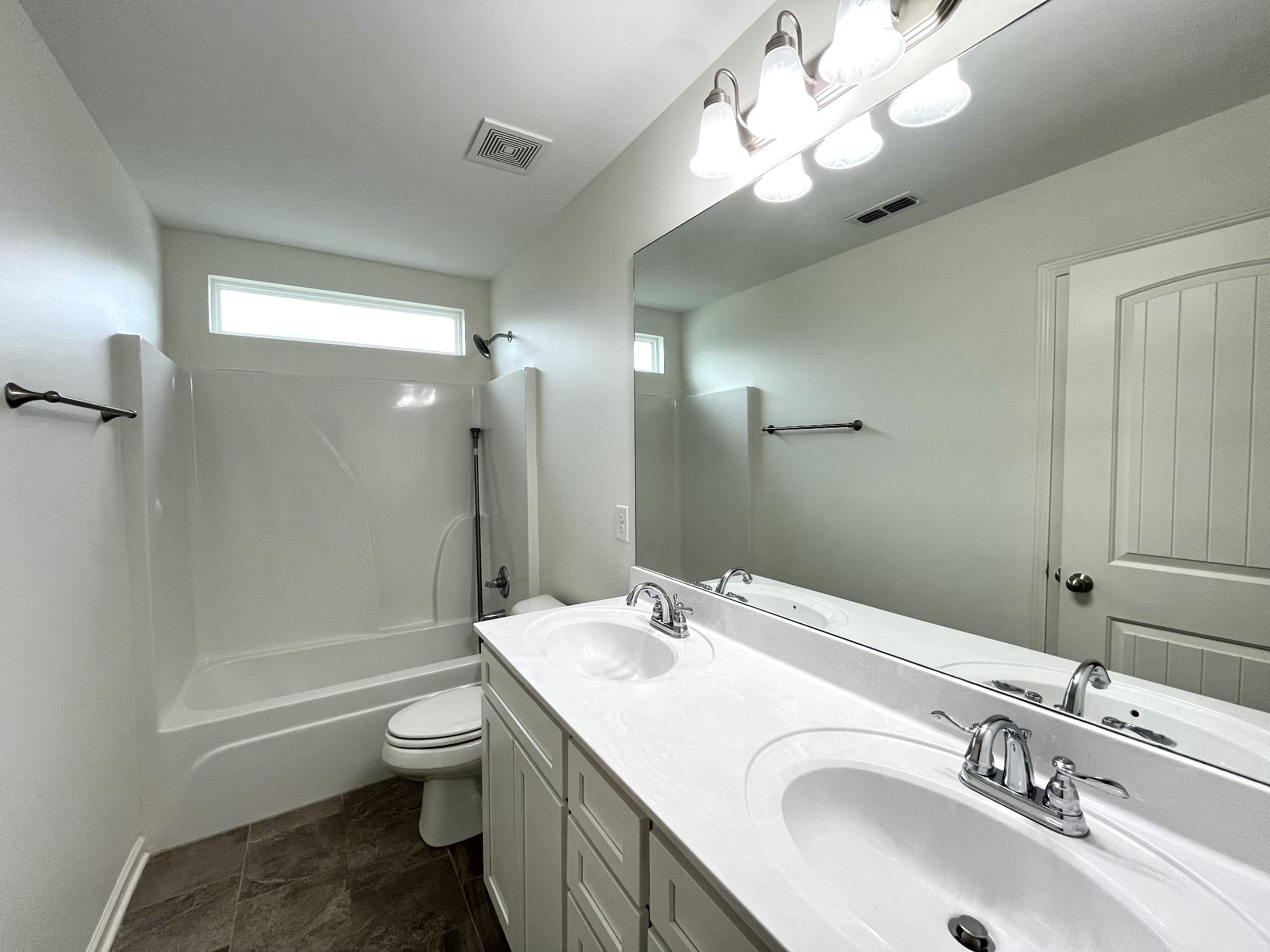105 East Coker Way Spring Hill, TN 37174 - Photo 21 of 23 a bathroom with a sink a toilet and shower