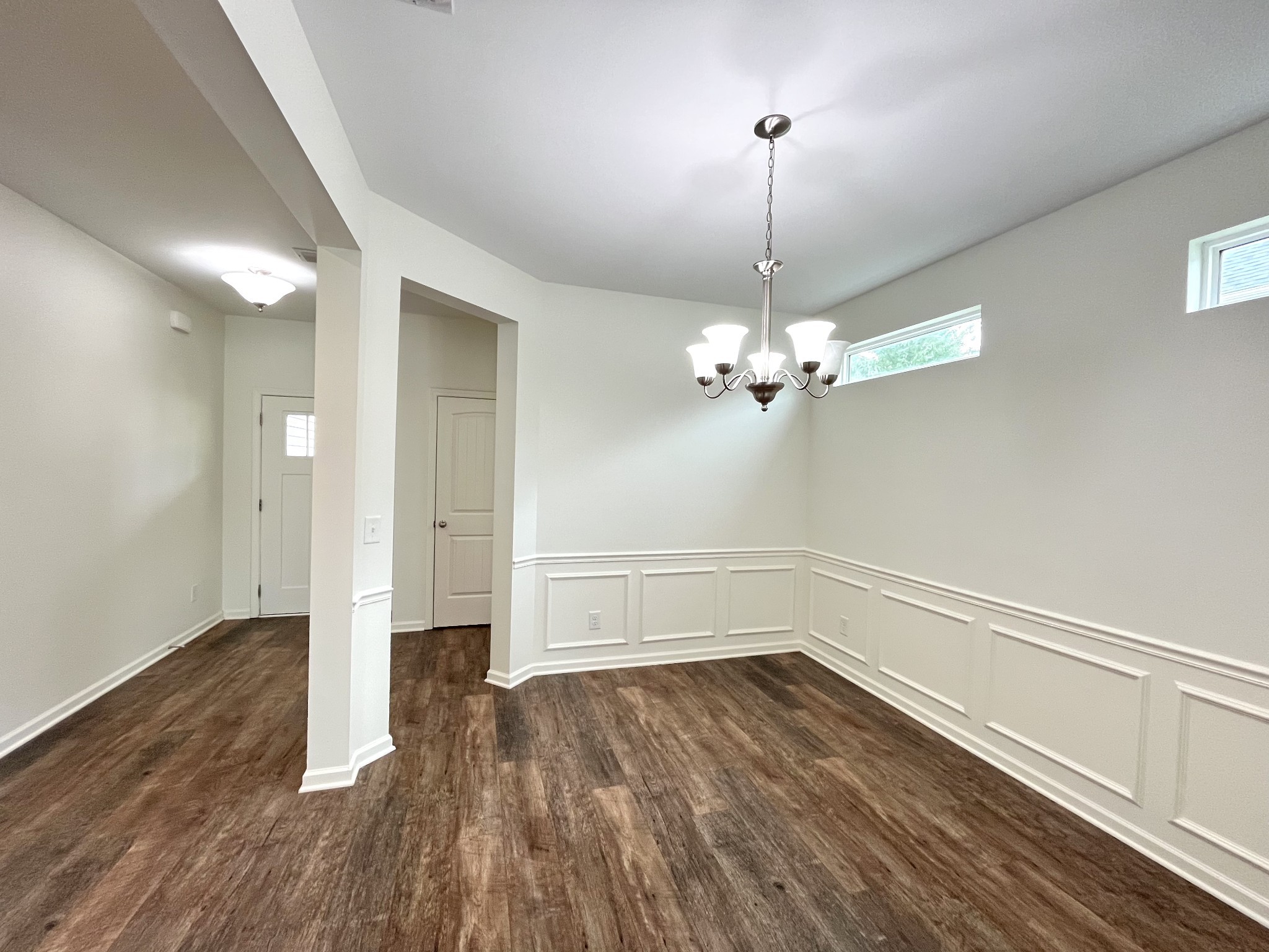 105 East Coker Way Spring Hill, TN 37174 - Photo 5 of 23 a view of a room with wooden floor and ceiling fan
