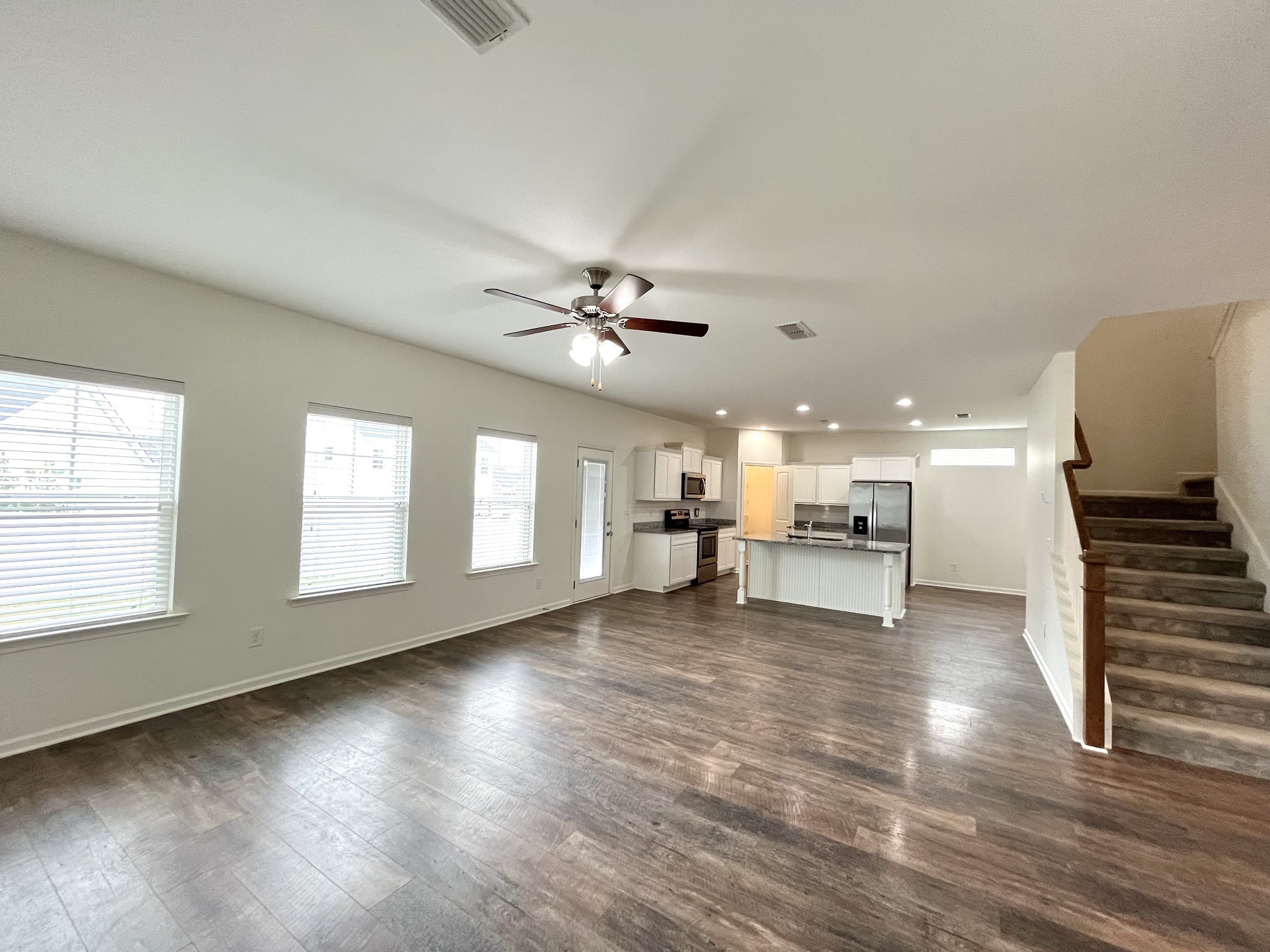 105 East Coker Way Spring Hill, TN 37174 - Photo 8 of 23 a view of an empty room with a window and wooden floor