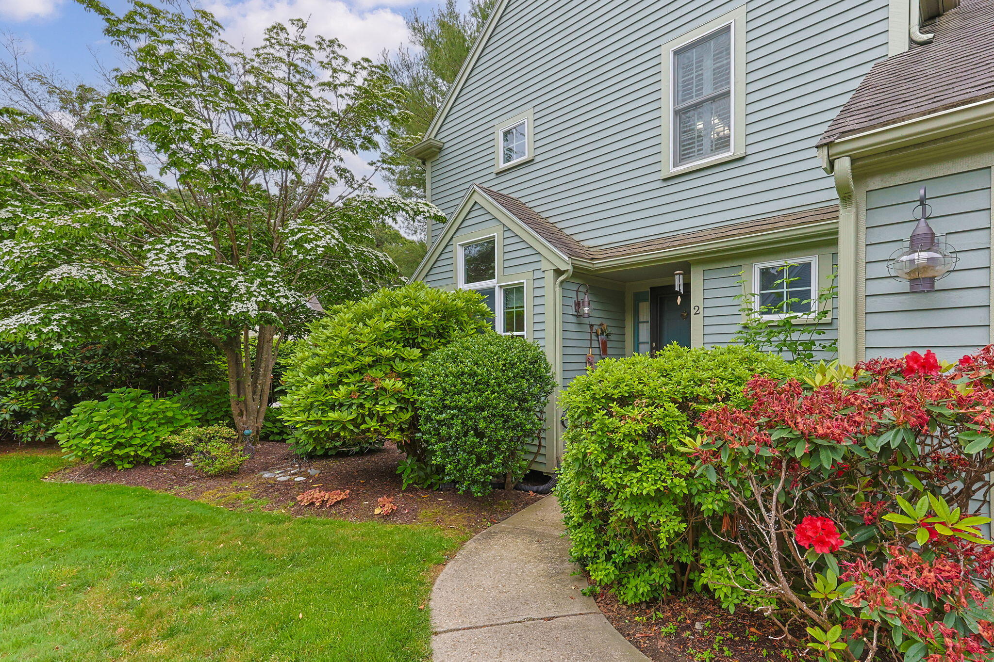2 Darby Point Mashpee, MA 02649 - Photo 2 of 47 a view of a house with a flower garden