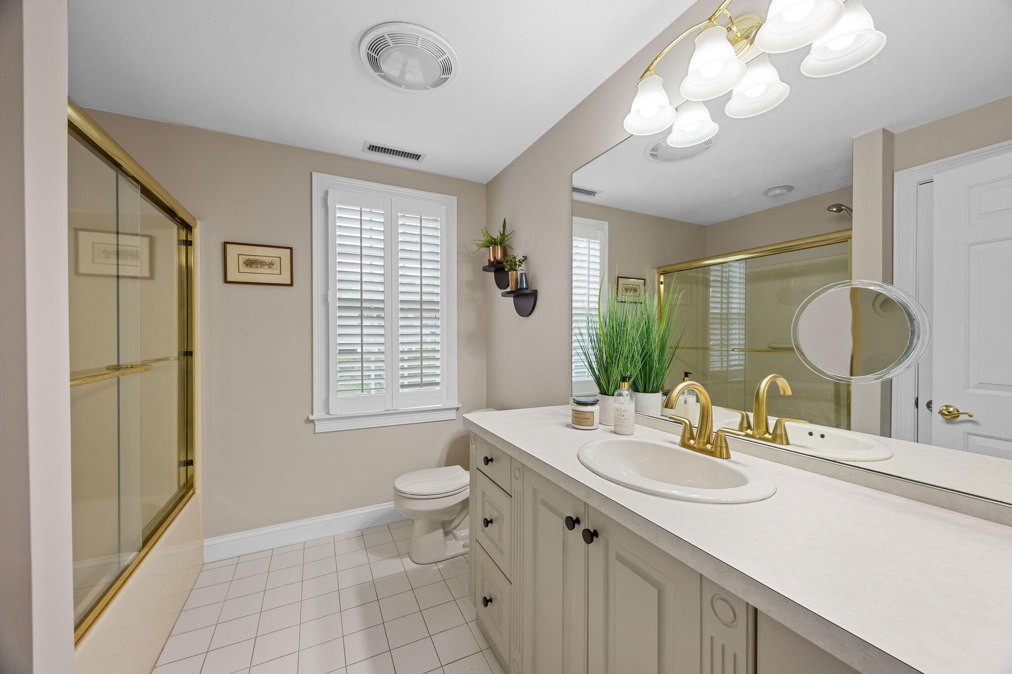 2 Darby Point Mashpee, MA 02649 - Photo 29 of 47 a bathroom with a double vanity sink a toilet and a mirror