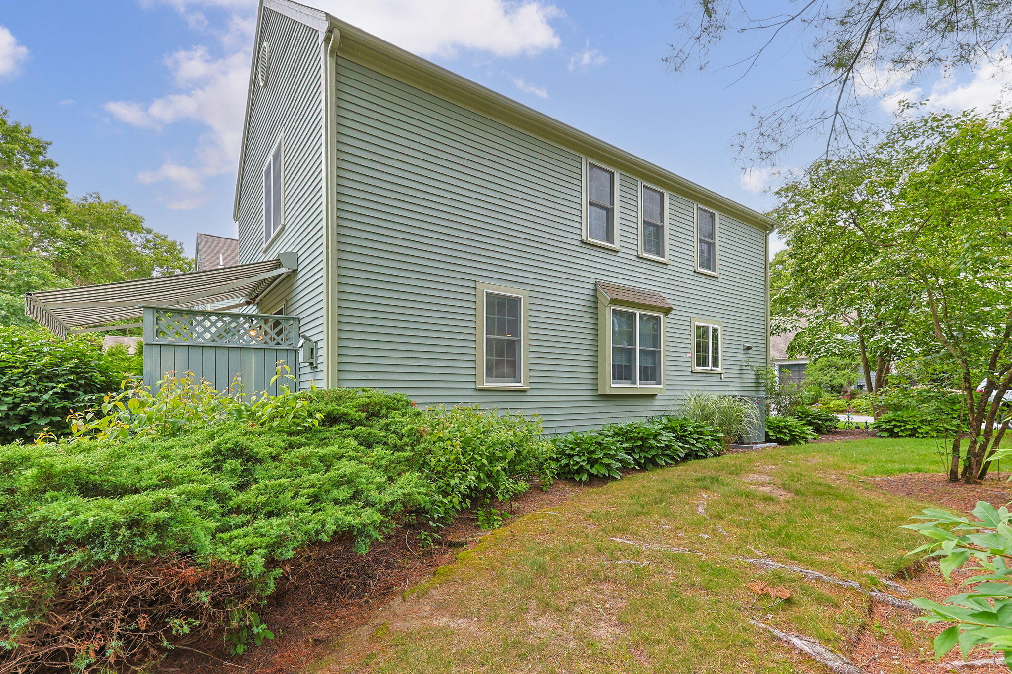 2 Darby Point Mashpee, MA 02649 - Photo 37 of 47 a front view of a house with a yard