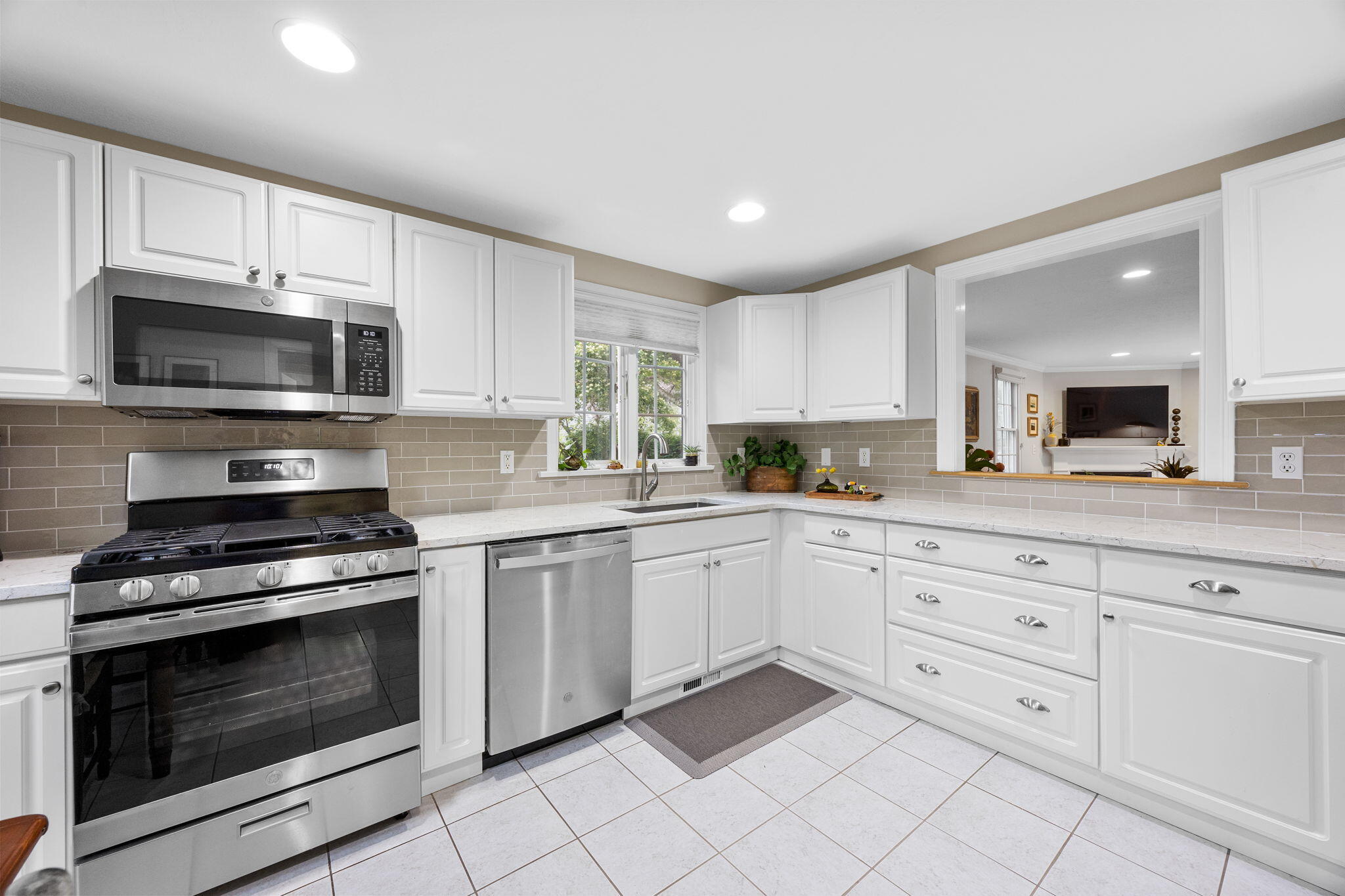 2 Darby Point Mashpee, MA 02649 - Photo 9 of 47 a kitchen with granite countertop white cabinets white stainless steel appliances and a sink