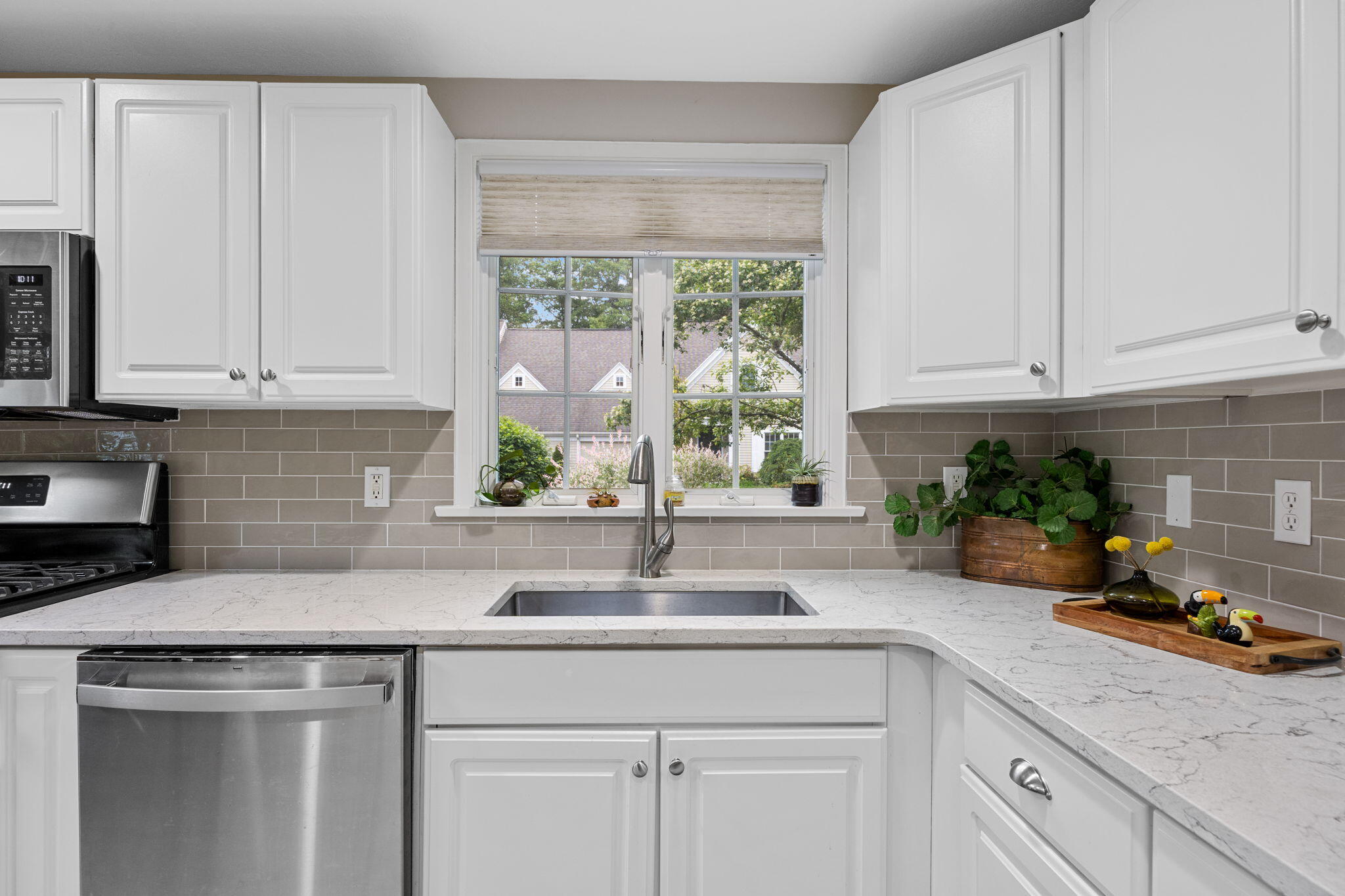 2 Darby Point Mashpee, MA 02649 - Photo 10 of 47 a kitchen with white cabinets and a window