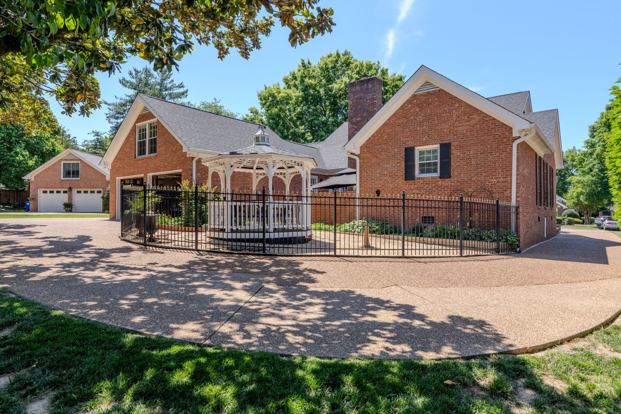 404 Chesterfield Place Franklin, TN 37064 - Photo 33 of 38 a front view of a house with a yard and garage