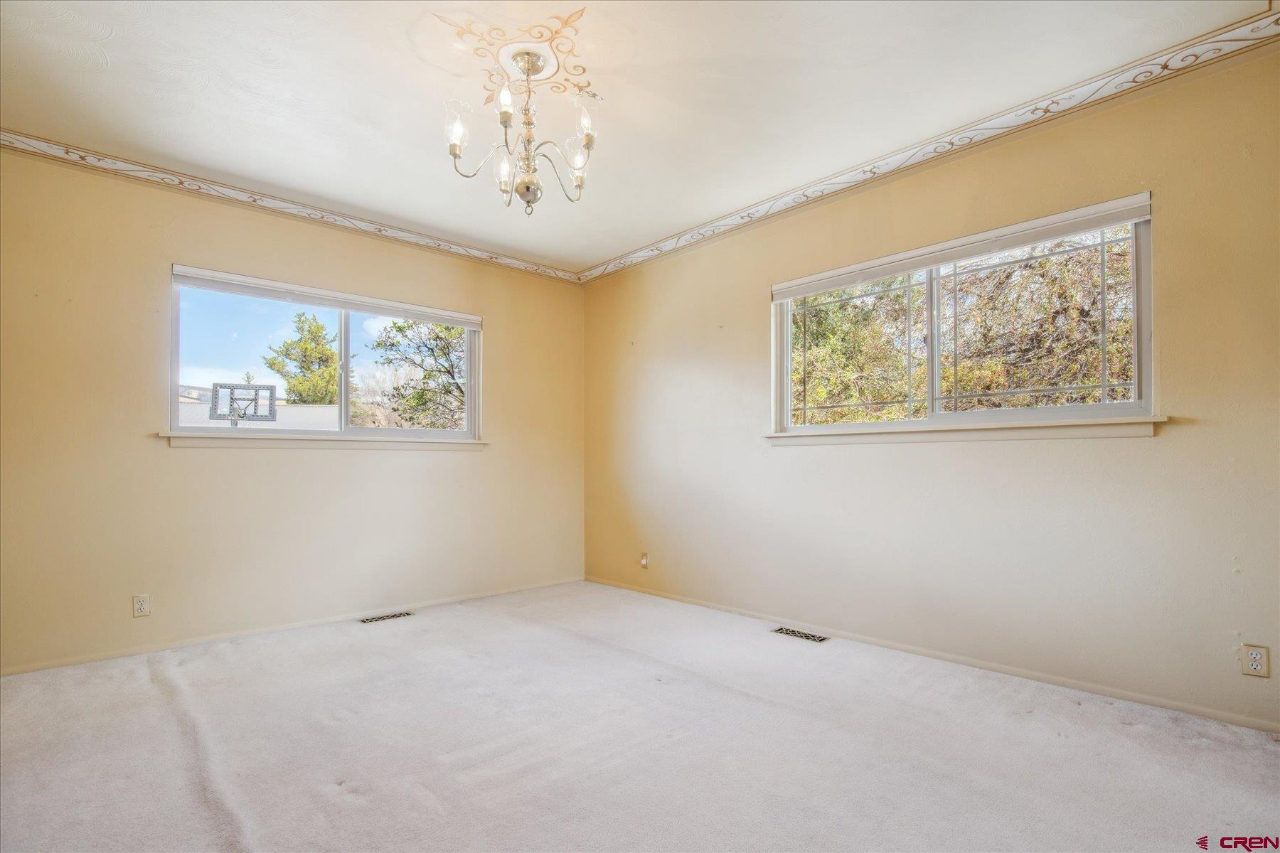 151 Riverview Drive Durango, CO 81301 - Photo 26 of 45 a view of an empty room with a painting on the wall