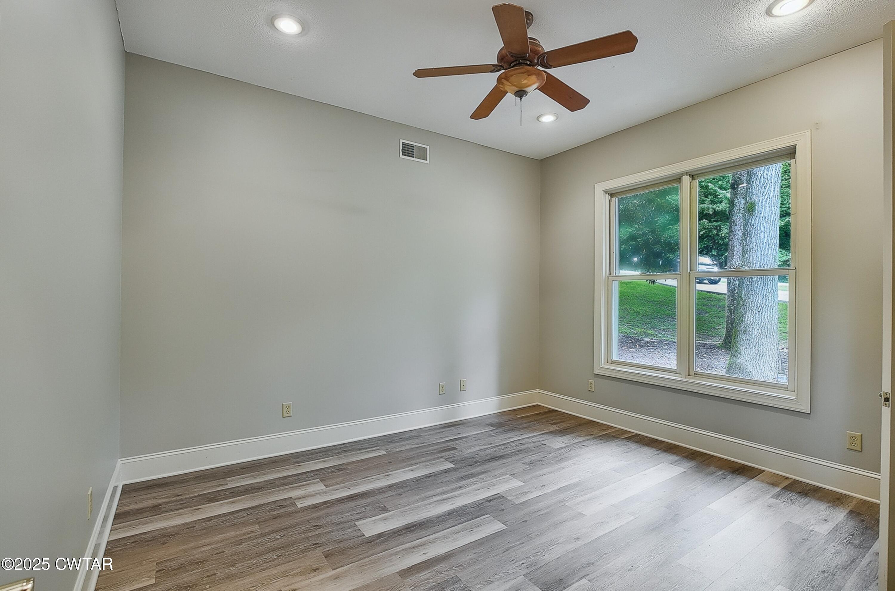 26 Bridlepath Drive Jackson, TN 38305 - Photo 36 of 53 wooden floor in an empty room with a window