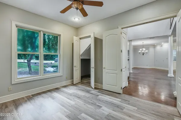 a bathroom with a granite countertop sink a mirror and a shower