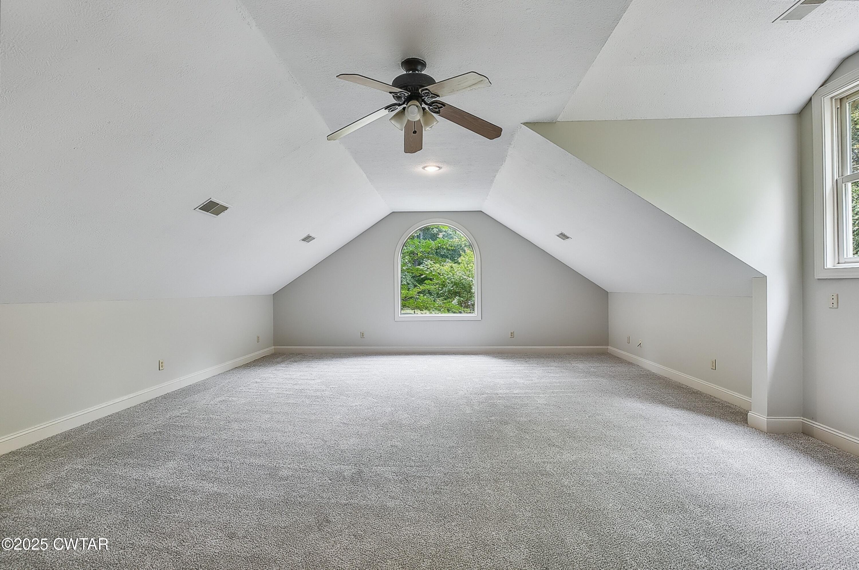 26 Bridlepath Drive Jackson, TN 38305 - Photo 40 of 53 an empty room with a window and a ceiling fan