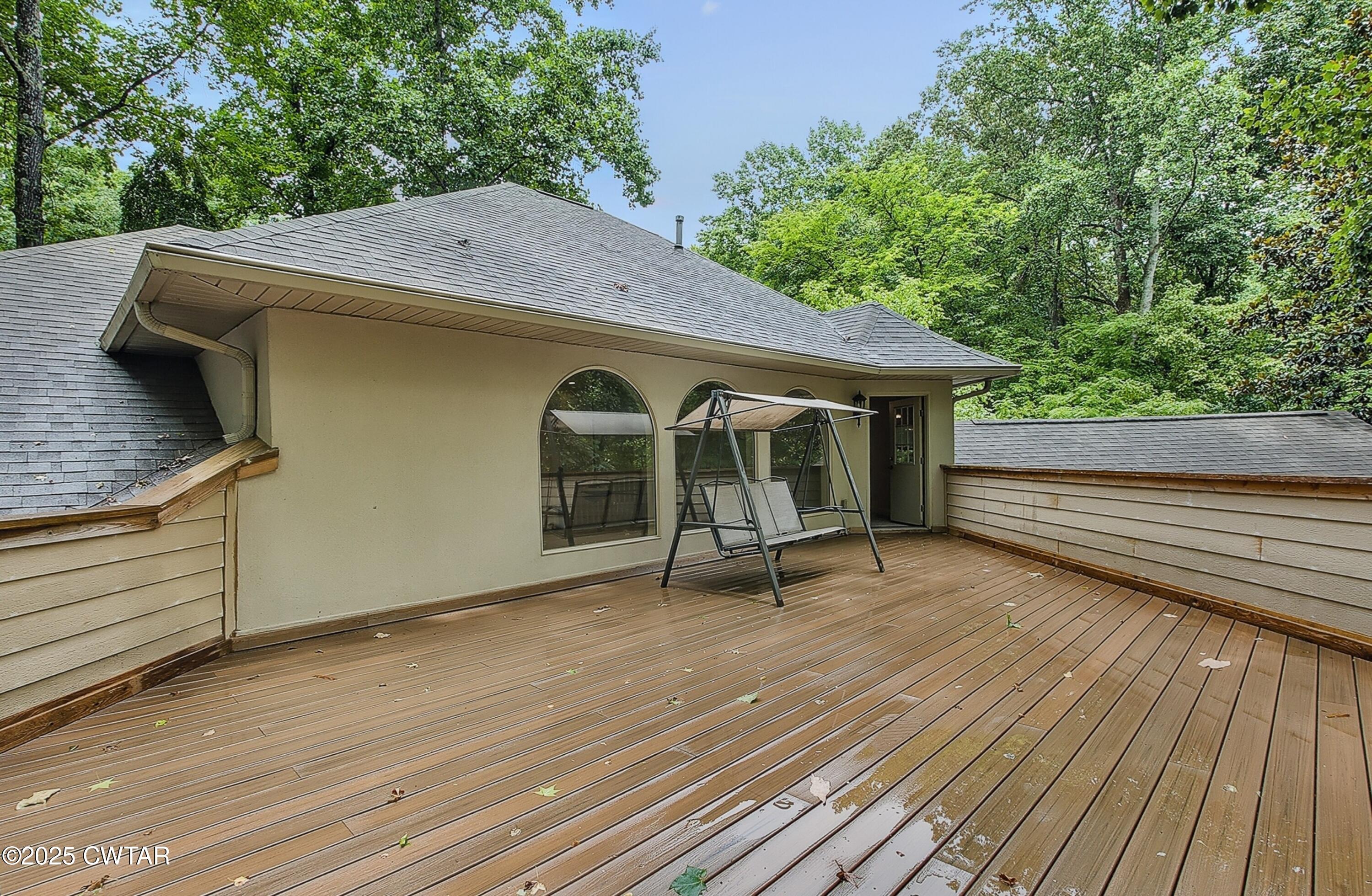26 Bridlepath Drive Jackson, TN 38305 - Photo 53 of 53 a view of a house with wooden deck and furniture