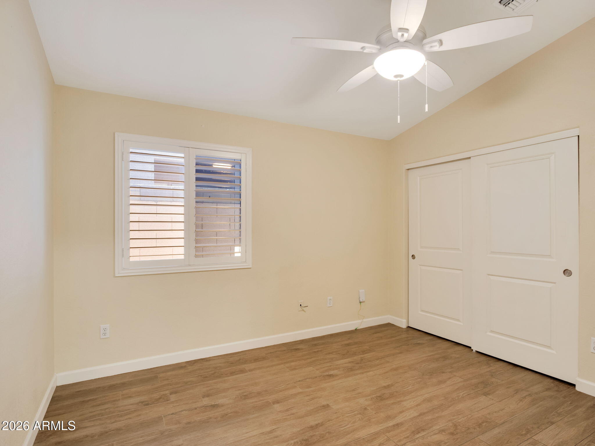 9151 West Boca Raton Road Peoria, AZ 85381 - Photo 6 of 14 Hall Bedroom with Plantation Shutters