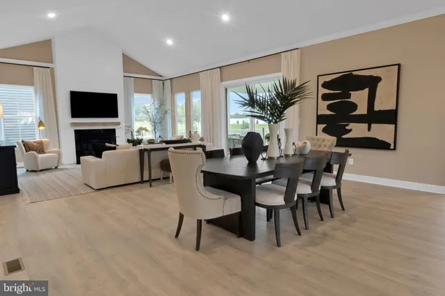 a view of a livingroom with furniture and a flat screen tv