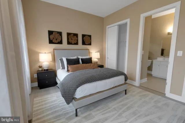 a bedroom with a bed and a walk in closet