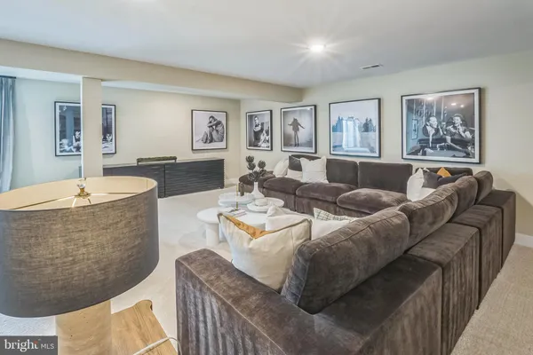 a living room with furniture and a table