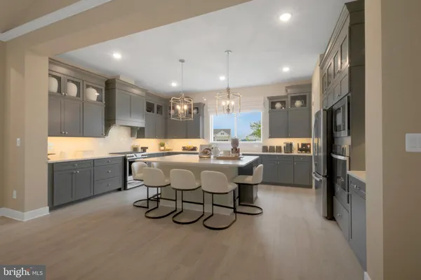 a large kitchen with a table and chairs
