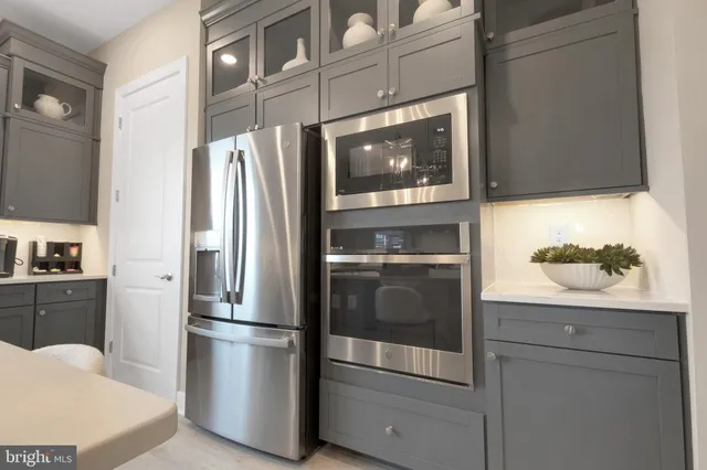 a kitchen with appliances and cabinets