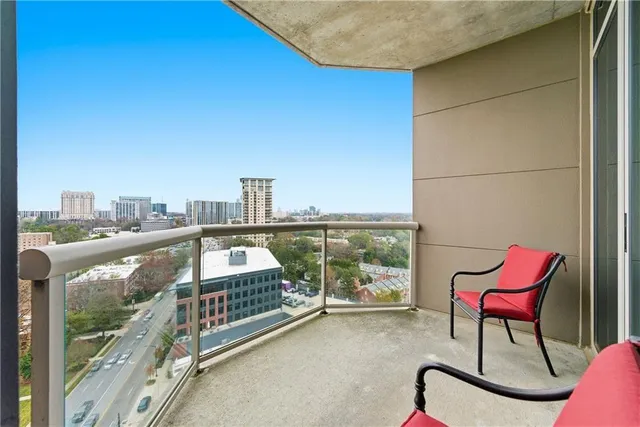 a view of a balcony with furniture